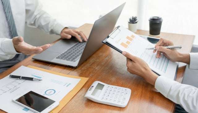 Why would an organization decide to outsource finance and accounting